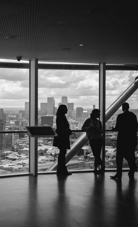 people standing inside city building