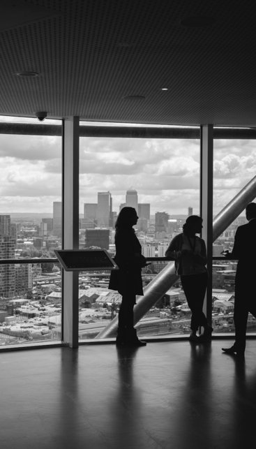 people standing inside city building